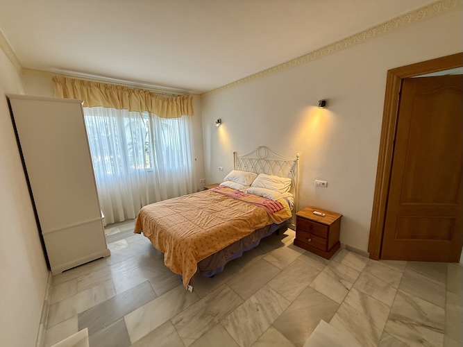 Double bedroom with pool and sea views