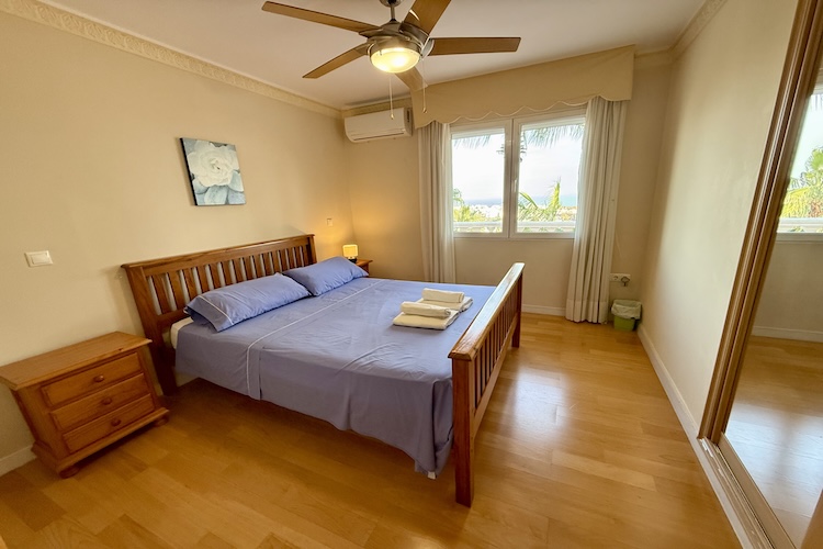 Double bedroom with pool and sea views