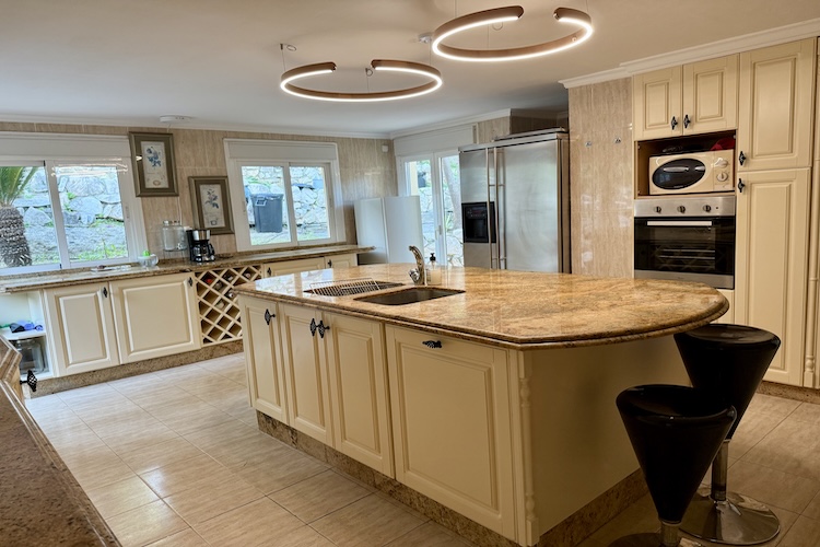 Main kitchen with access to back garden